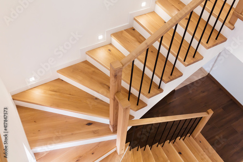 Fotografija Wood staircase inside contemporary white modern house.