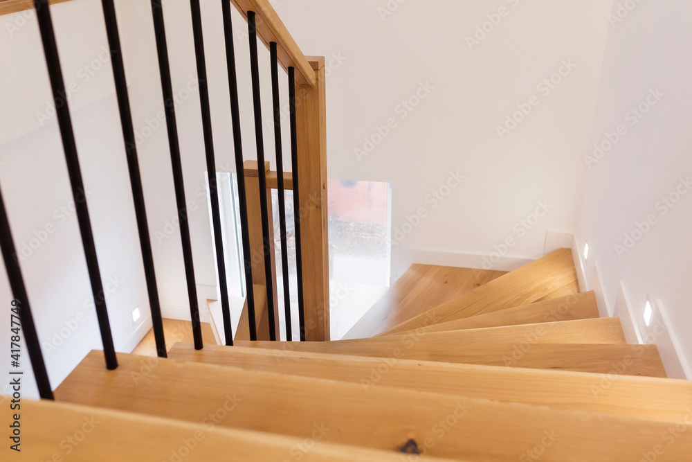 Wood staircase inside contemporary white modern house. Wood staircase inside contemporary white modern house.