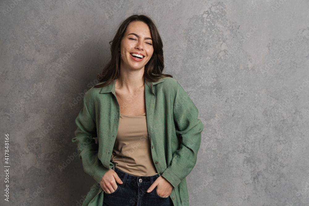 Happy beautiful brunette girl laughing and looking at camera Happy beautiful brunette girl laughing and looking at camera