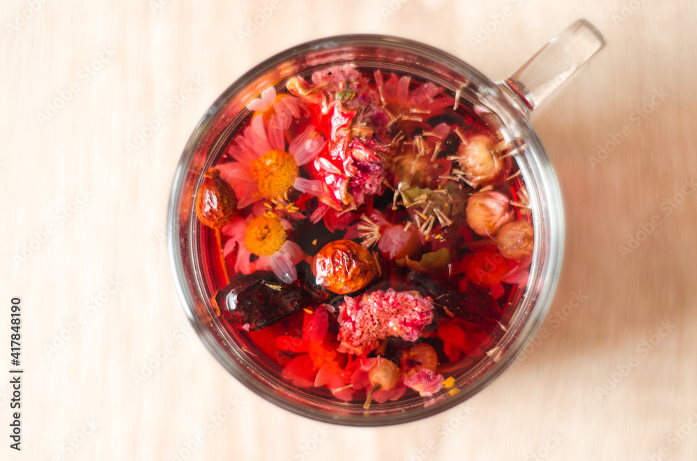 Close up photo of cup of hibiscus tea on the table in the morning Close up photo of cup of hibiscus tea on the table in the morning