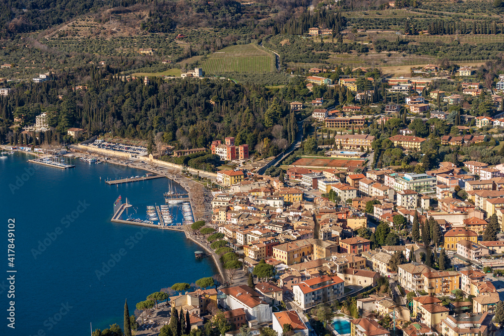Aerial View of the Small Garda Town, tourist resort on the coast of Lake Garda, view from the Rocca di Garda, small hill overlooking the lake. Verona province, Veneto, Italy, Europe.