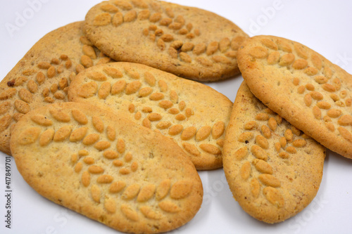 Useful satisfying slim cookies with nuts and bran located on a white background. 