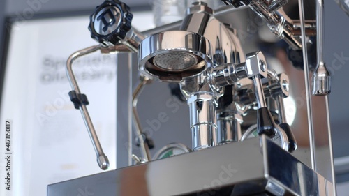 Details of one group home manual espresso coffee machine. Shower screen shot from a low angle. high-quality photo. 