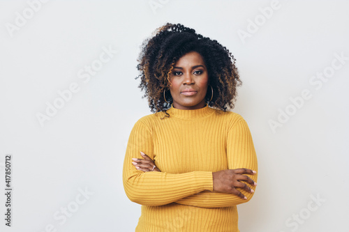 Portrait of a serious black woman with arms crossed photo