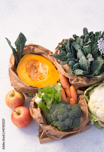 Variety of seasonal fresh raw vegetable ingredients, biologic and km0, for cooking of healthy and vegan dishes. Autumn / winter vegetable still life. Top view close-up. photo