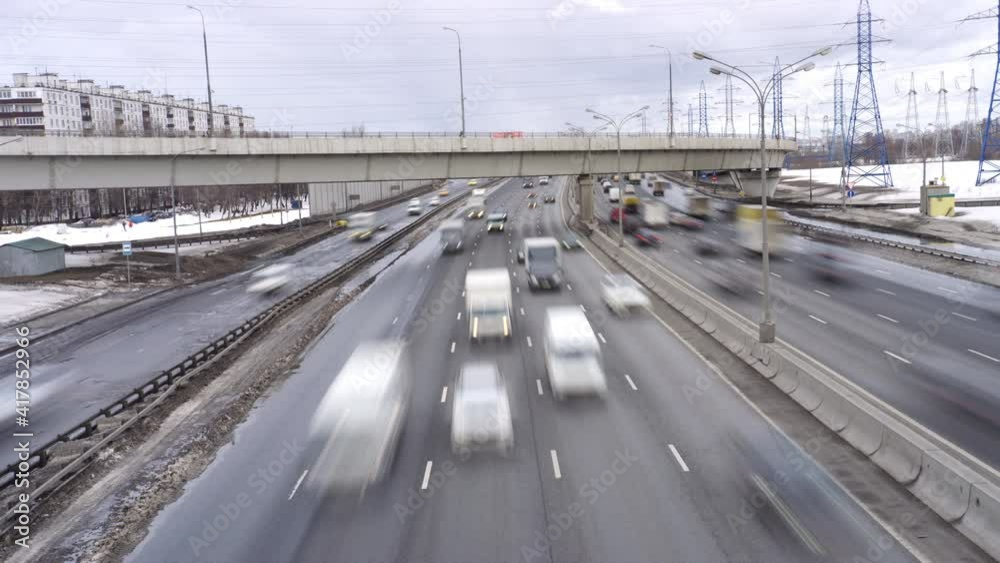 Cars move fast along the busy urban highway. Stressful big city life of dangerous driving concept. Long exposure time lapse Cars move fast along the busy urban highway. Stressful big city life of dangerous driving concept. Long exposure time lapse