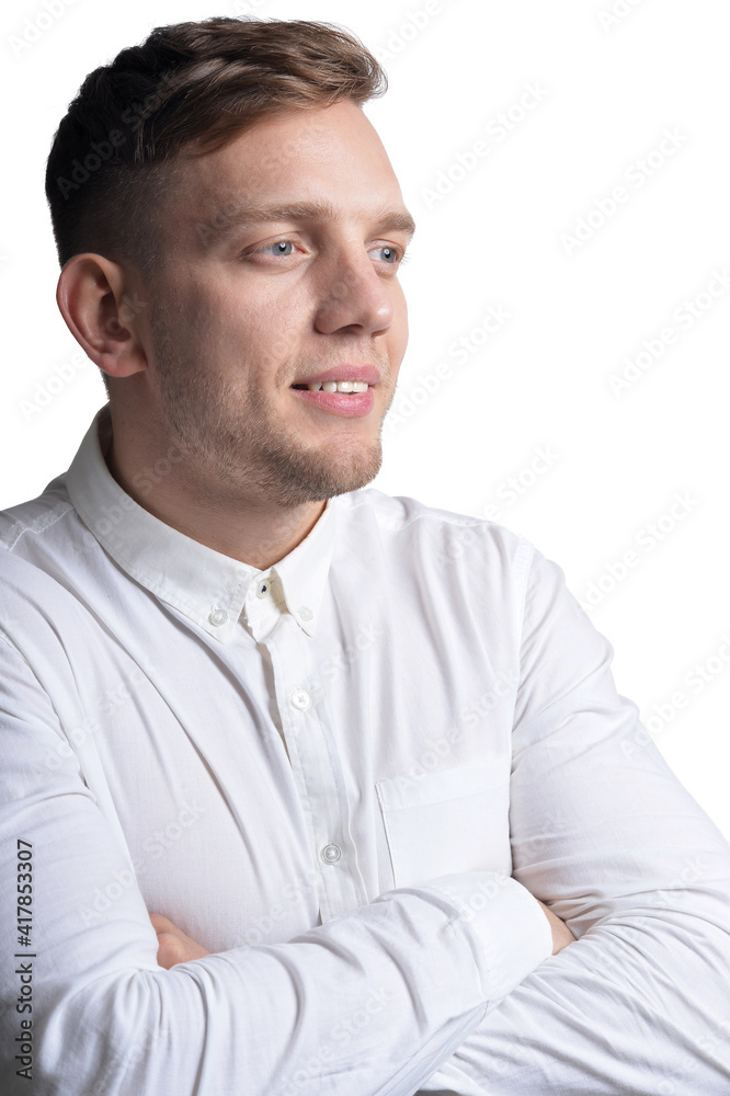 Portrait of handsome smiling young man wearing white shirt Portrait of handsome smiling young man wearing white shirt