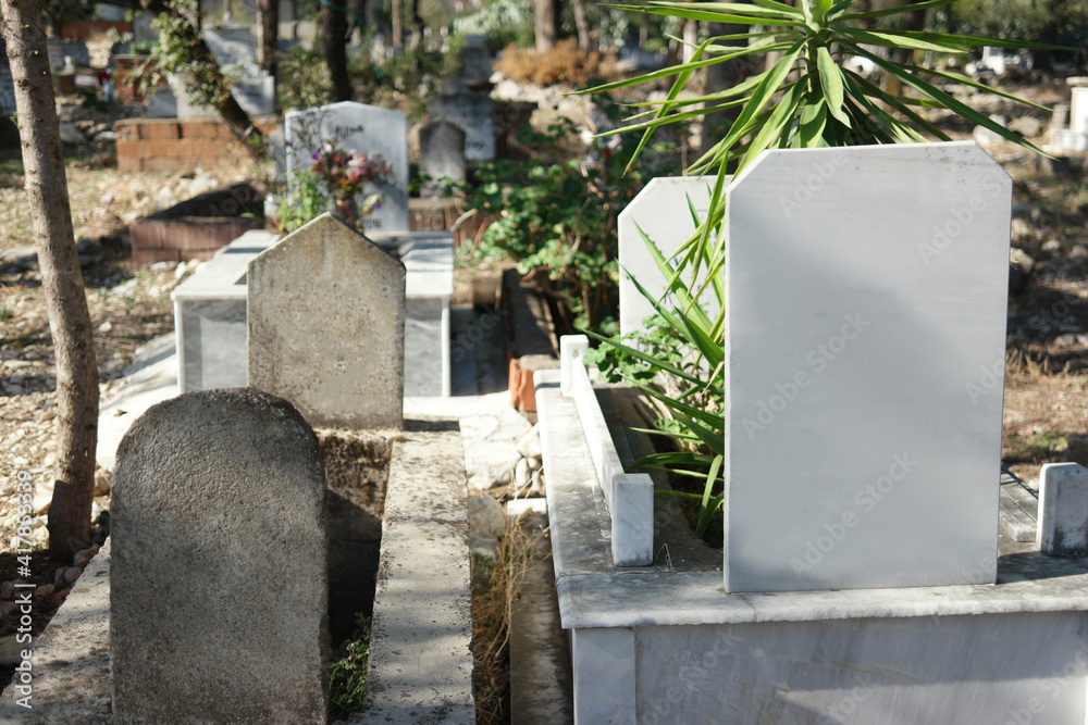 Tombstones at Muslim cemetery. Islamic graveyard in Turkey. Tombstones at Muslim cemetery. Islamic graveyard in Turkey.