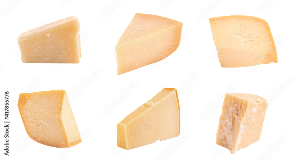 Set with pieces of delicious parmesan cheese on white background