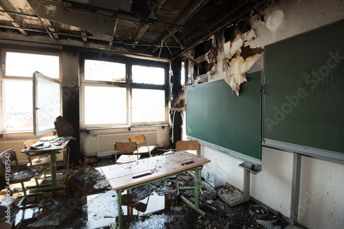 empty and destroyed class room after fire photo