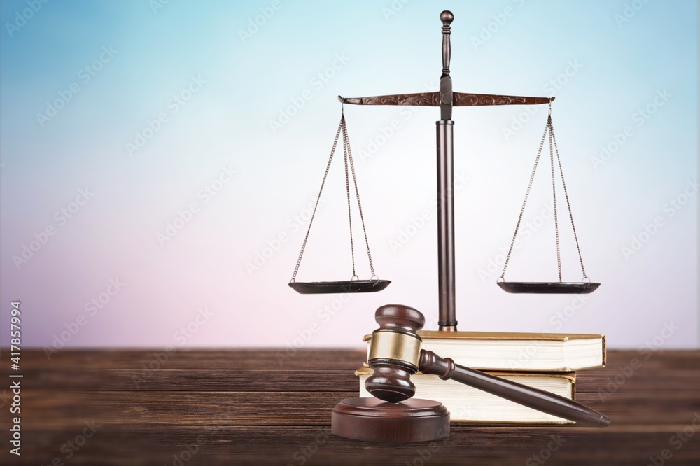 Justice Scales and books and wooden gavel on the table. Justice Scales and books and wooden gavel on the table.