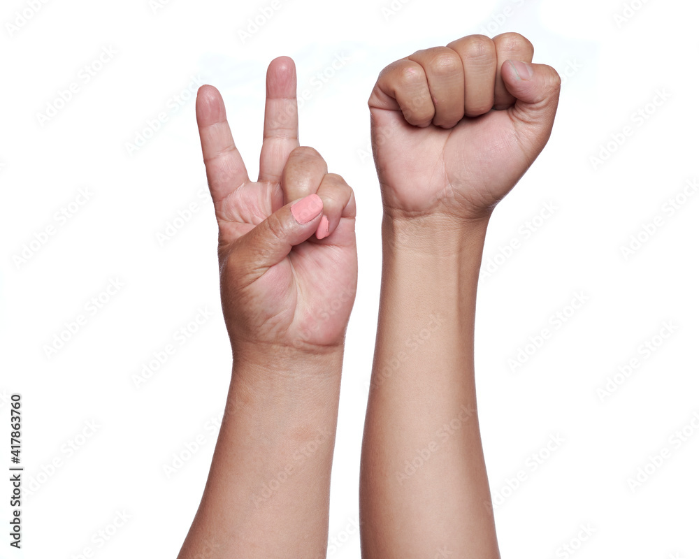 Woman's hands forming the peace sign and the fight sign