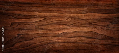 Panel kuchenny z motywem Walnut tree texture close up. Wide walnut wood texture background. Walnut veneer is used in luxury finishes.