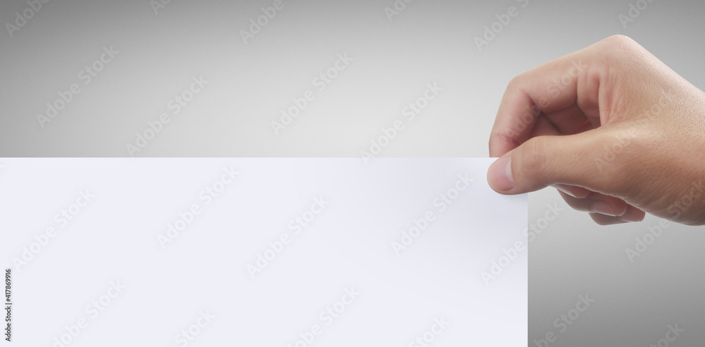 Obraz premium Hands holding white empty paper.