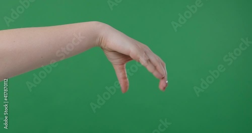 Hand pick up something big on green background