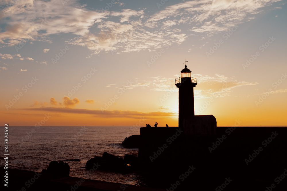 scenic view of lighthouse against sunset in porto