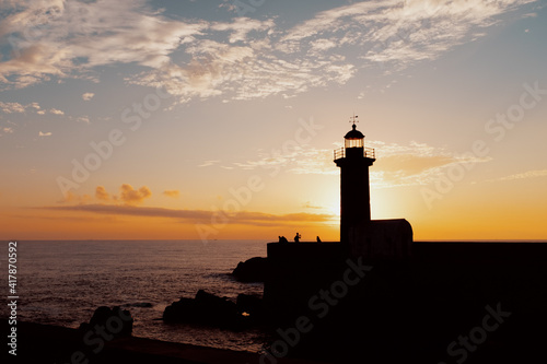 scenic view of lighthouse against sunset in porto