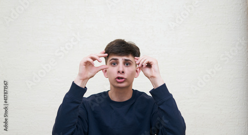 portrait of an indignant young man, trying to explain