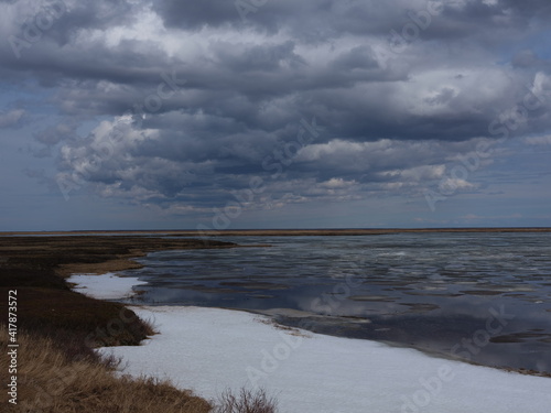 Spring coast of the Arctic Ocean. Beautiful sky and ice crystals. Artistic noise