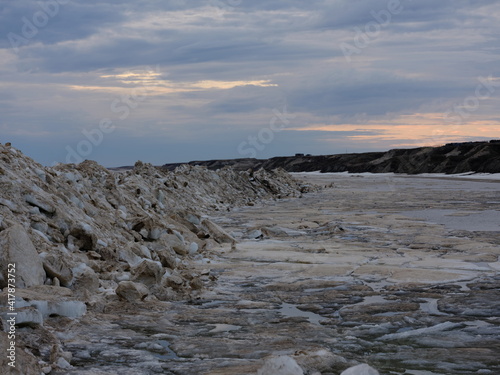 Spring coast of the Arctic Ocean. Beautiful sky and ice crystals. Artistic noise