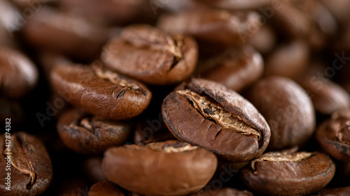 Falling Roasted Coffee Beans, Macro Shot, close-up.