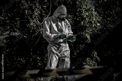 Asian scientist wear Chemical protection suit check danger chemical,working at dangerous zone,Collecting samples in case of Corona virus investigation outbreaked from China.
