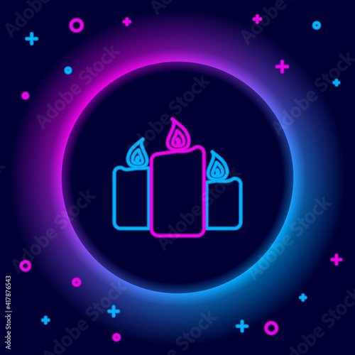 Glowing neon line Burning candles icon isolated on black background. Old fashioned lit candles. Cylindrical aromatic candle sticks with burning flames. Colorful outline concept. Vector.