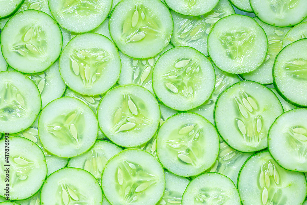 Fresh cucumber slices background. Fresh cucumber slices background.