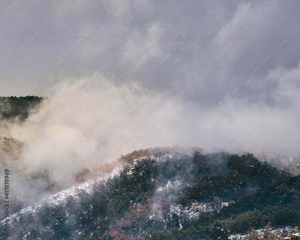 Snowy and foggy mountain view Snowy and foggy mountain view