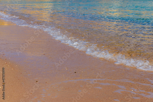 Closeup of the sand on beach and Red sea water