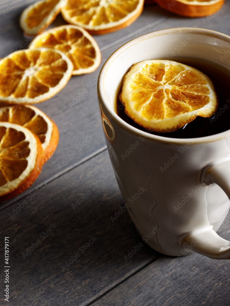 Tea with slice of orange fruit. Dried orange slices as addition to hot beverage. Tea with slice of orange fruit. Dried orange slices as addition to hot beverage.