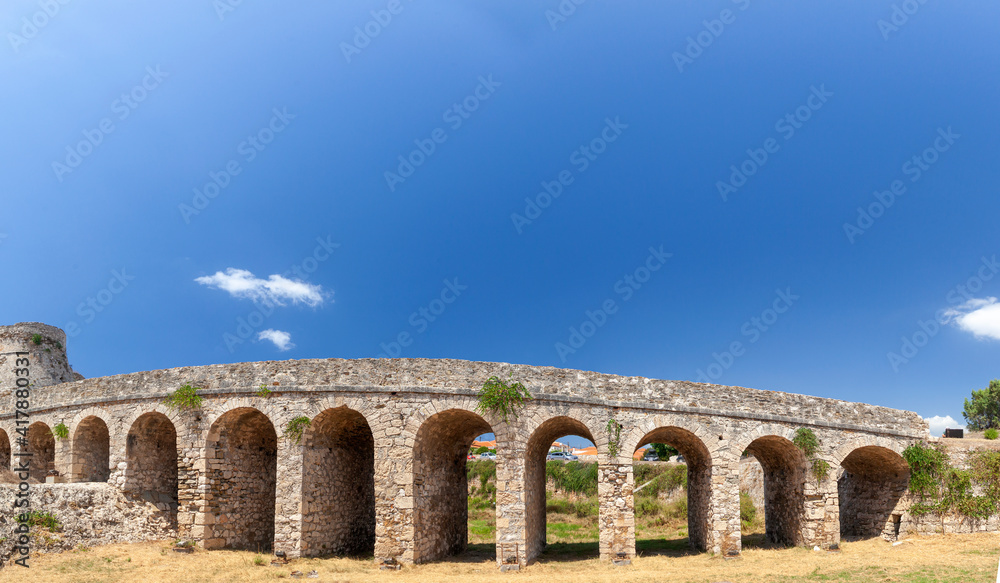 The stone bridge that crosses the ditch and leads to the Venetian castle of Methoni, Messinia, Peloponnese, Greece