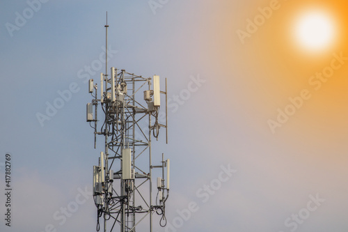 5G telecommunication tower 5G mobile phone wireless antenna machine Located in the center of the city against a blue sky background.