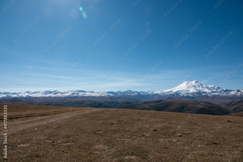 Elbrus And Green Hills At Sunny Summer Day. Elbrus Region, North Caucasus, Russia