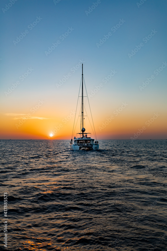 Sunset over the sea with yacht silhouette. Sunset over the sea with yacht silhouette.