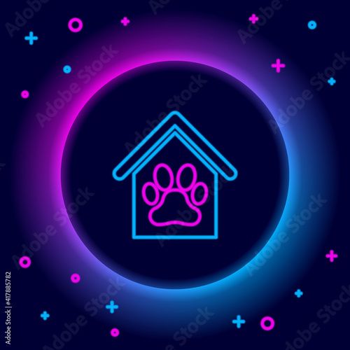 Glowing neon line Dog house and paw print pet icon isolated on black background. Dog kennel. Colorful outline concept. Vector.