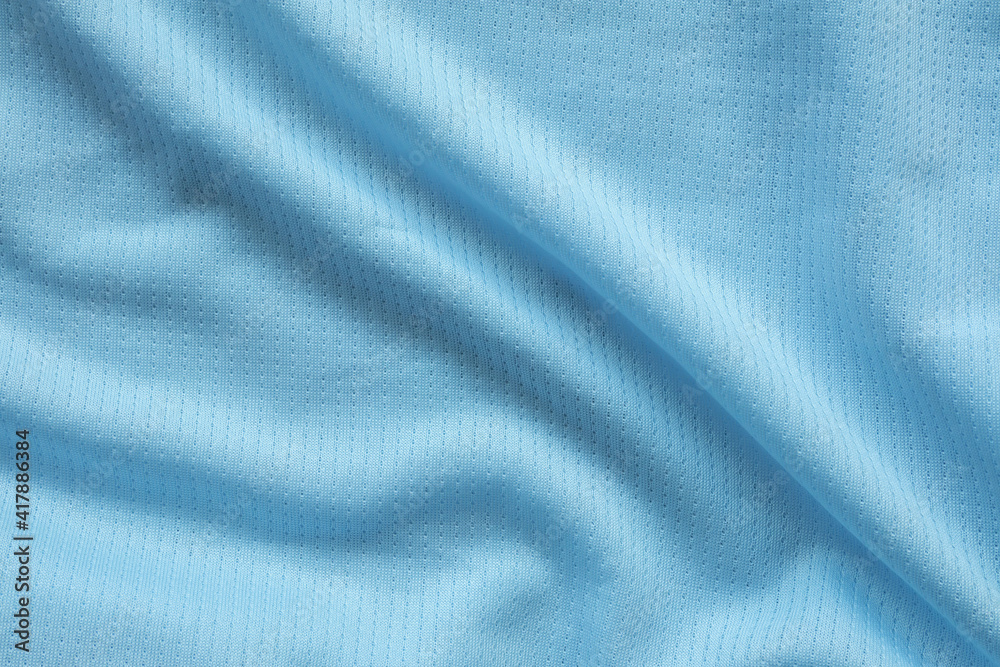 Blue football jersey clothing fabric texture sports wear background Blue football jersey clothing fabric texture sports wear background