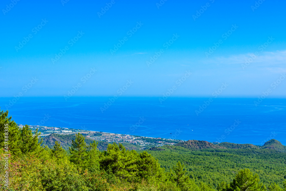 View on Mediterranean sea and village from the summit of Tahtali mountain View on Mediterranean sea and village from the summit of Tahtali mountain