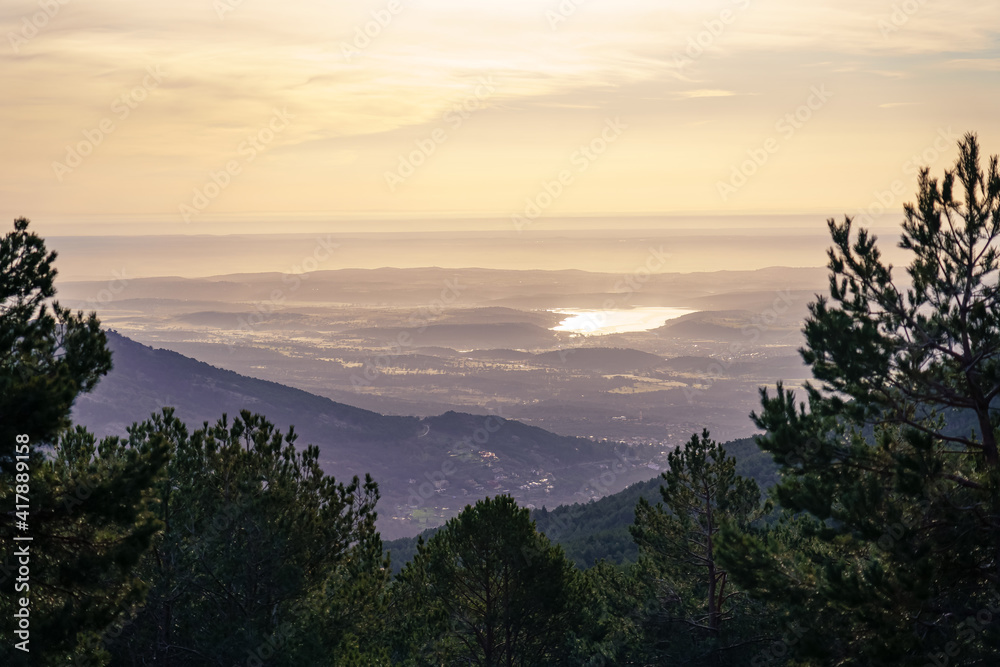 green mountain landscape, at sunrise with golden tones and a view of the horizon with large areas of land. La Morcuera Madrid.