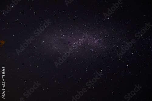 a long exposure of the dark sky with the stars