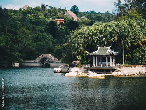 A small Pavilion on a lake inside Xiamen botanical garden,near the Nanputuo Temple in Xiamen,Fujian,China photo