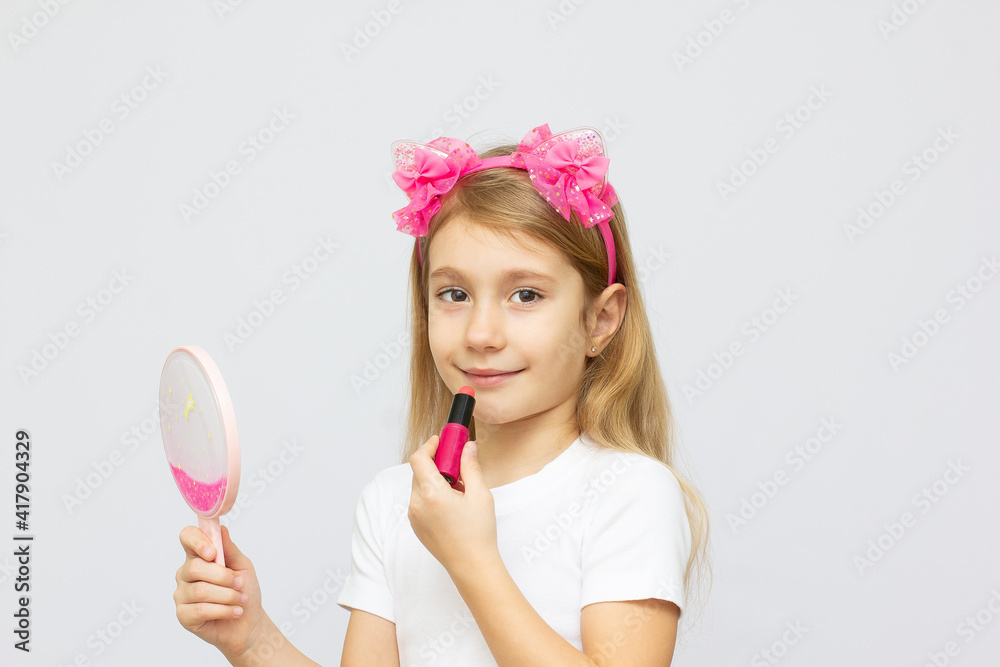 closeup portrait of the little girl with lipstick closeup portrait of the little girl with lipstick