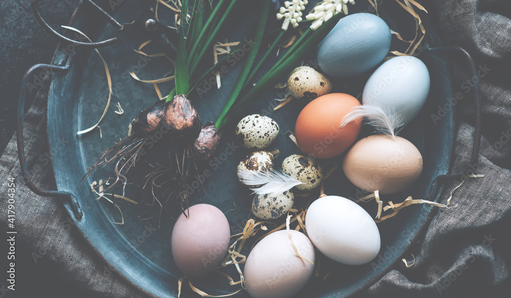 Vintage background with easter eggs in basket on dark background ...