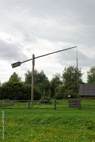 traditional russian wooden crane well in the village