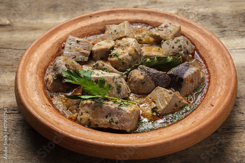 Traditional homemade fish tajin stew with potatoes