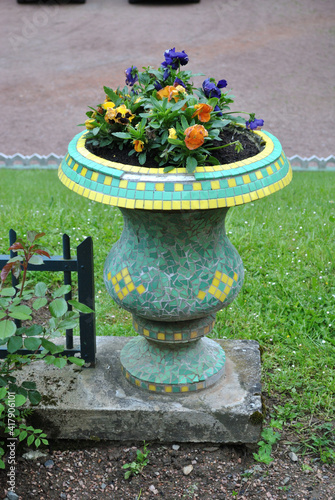 Colourful Flowering Pansies in Mosaic Decorated Outdoor Garden Urn 