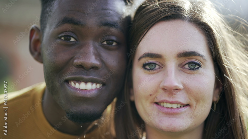 African man and white girl opening eyes together. Interracial couple looking at camera African man and white girl opening eyes together. Interracial couple looking at camera