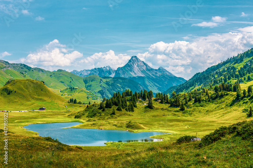 Fototapeta Naklejka Na Ścianę i Meble -  The lake Kalbelesee, a high mountain lake on the Hochtann Mountain Pas in the Austrian state of Vorarlberg.