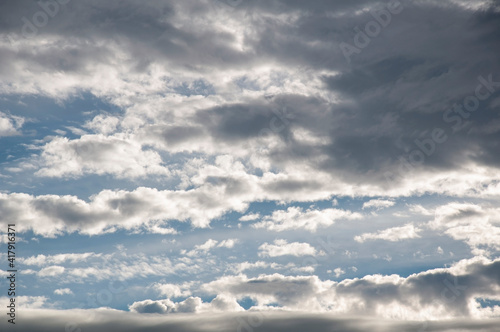 Storm clouds rolling in sunshine sky in the nature skyscape that is pretty and dramatic.
