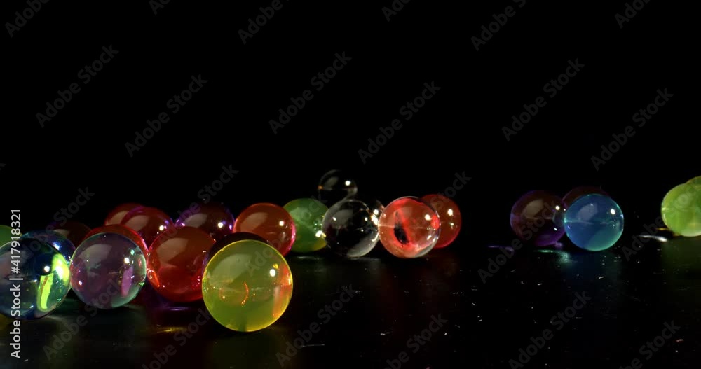 Abstract random appearance of glass spheres interacting with each other. Motion concept. High quality.